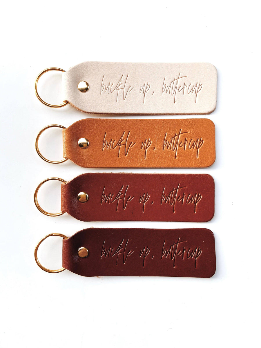 Twin Sparrow - "Buckle Up Buttercup" Script Keychain: Camel / Gold / Flat