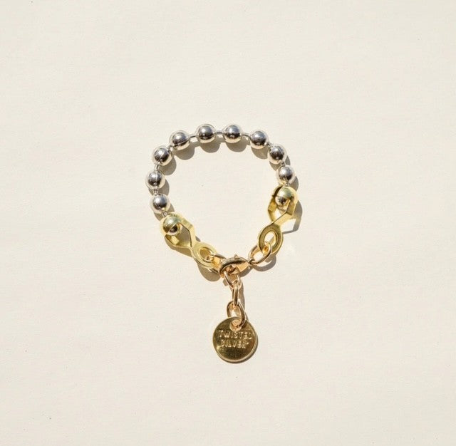 Ball and Chain Bracelet Gorgeous mixed metal bracelets that masterfully combine industrial with elegant.  -Raw brass or silver  -Adjustable 8.5-9.5 in length