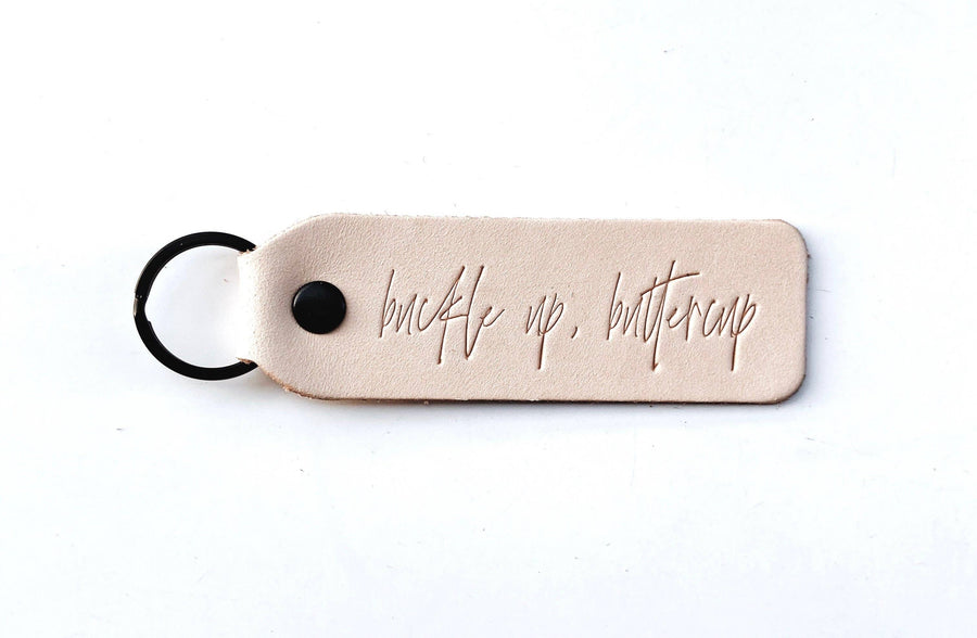Twin Sparrow - "Buckle Up Buttercup" Script Keychain: Camel / Gold / Flat